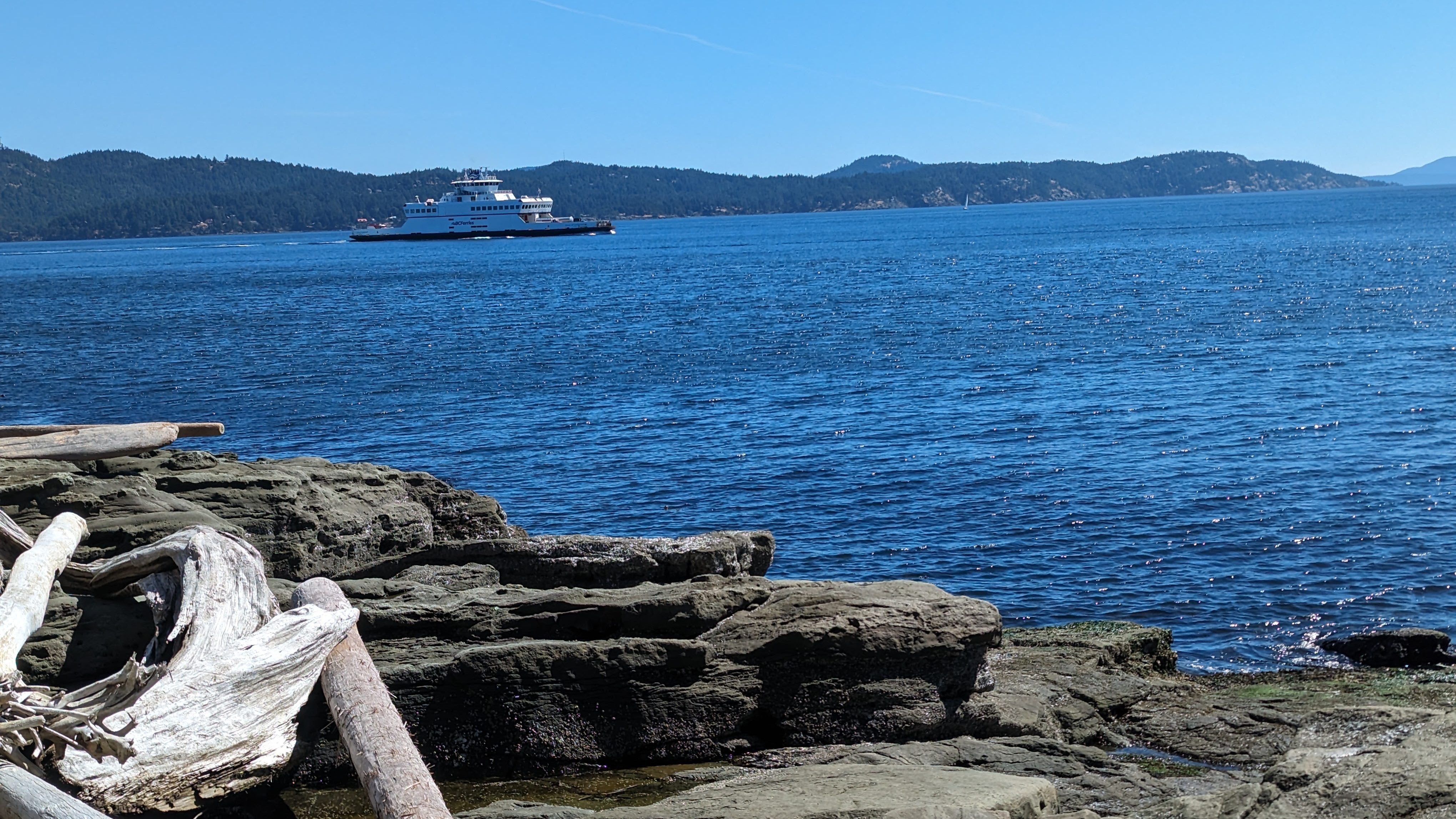 Ferry sailing off the coast of an island