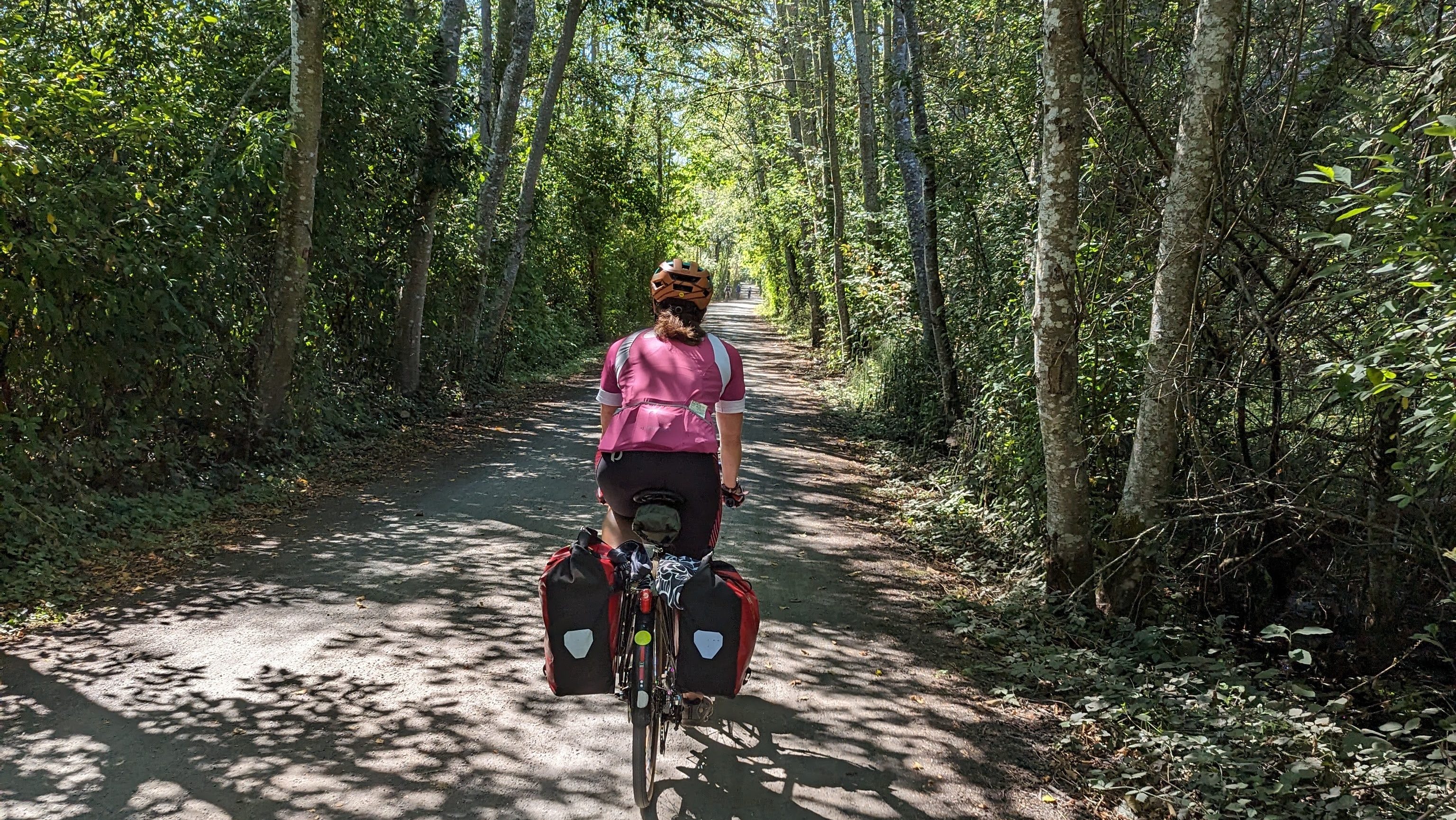 Woman biking on a trail